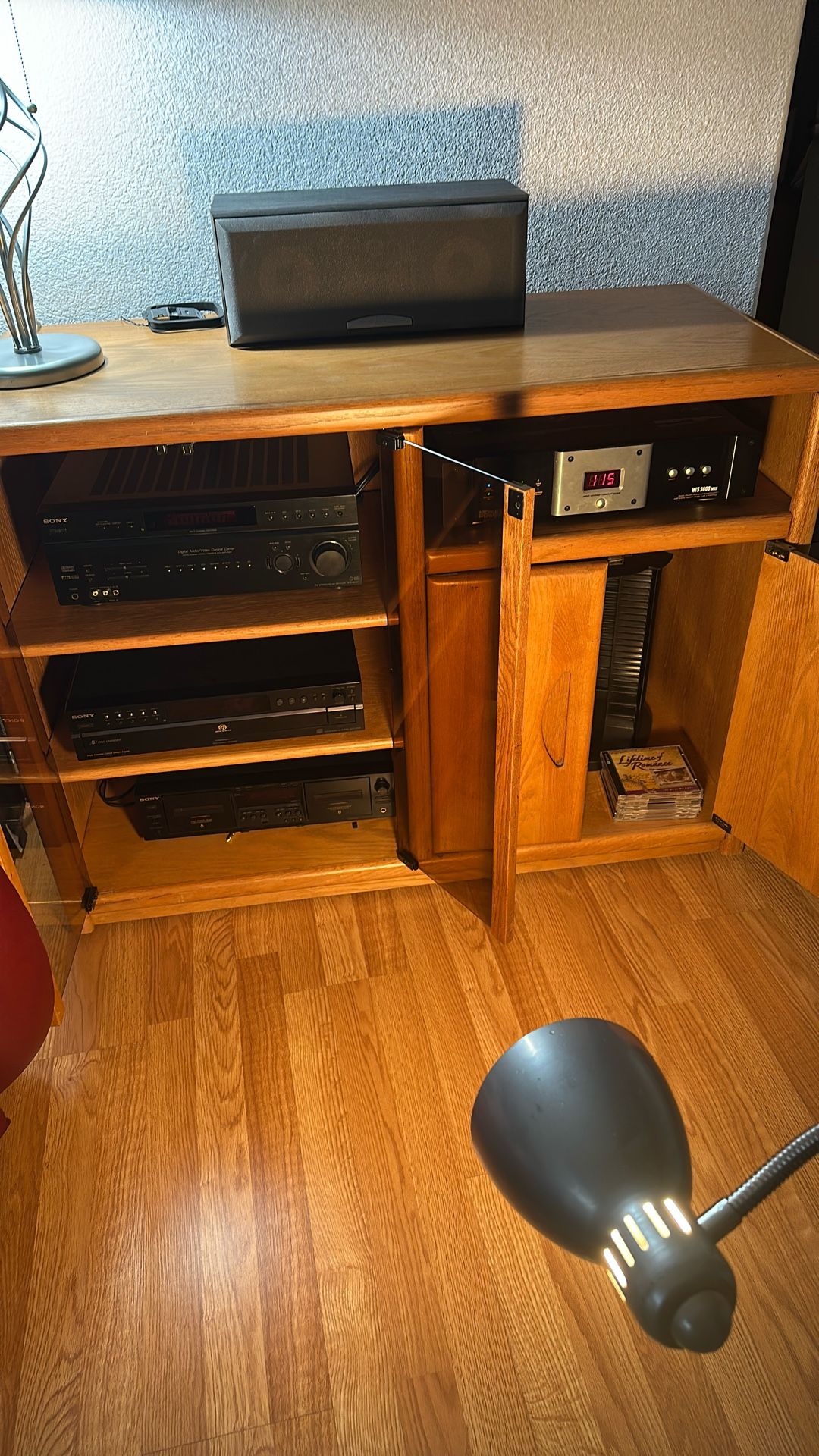 Oak stereo cabinet Has complete entertainment system in it