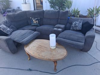 Living Spaces sectional couch, coffee table, and lamp