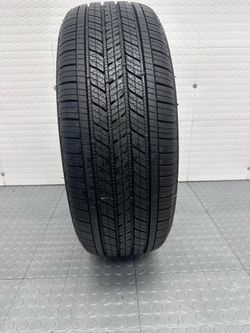 One excellent used tire Bridgestone 215/60/17 # 1267