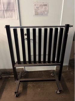 Rolling dumb bell rack