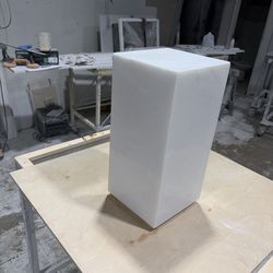 Italian white rhino floating pedestal with mitred edges and built in stand