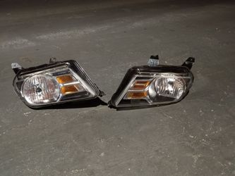 2010-2012 Ford Mustang headlights with light bulbs and accessories oem.
