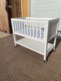 White Wood Baby Bassinet with Storage Shelf