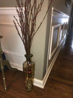 Flower arrangement tall yellow glass vase