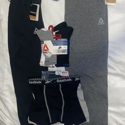 Reebok Lot of 4 Boys. Two Joggers, 3 Pack of Boxer, Briefs, 6 Pack of Crew Socks.