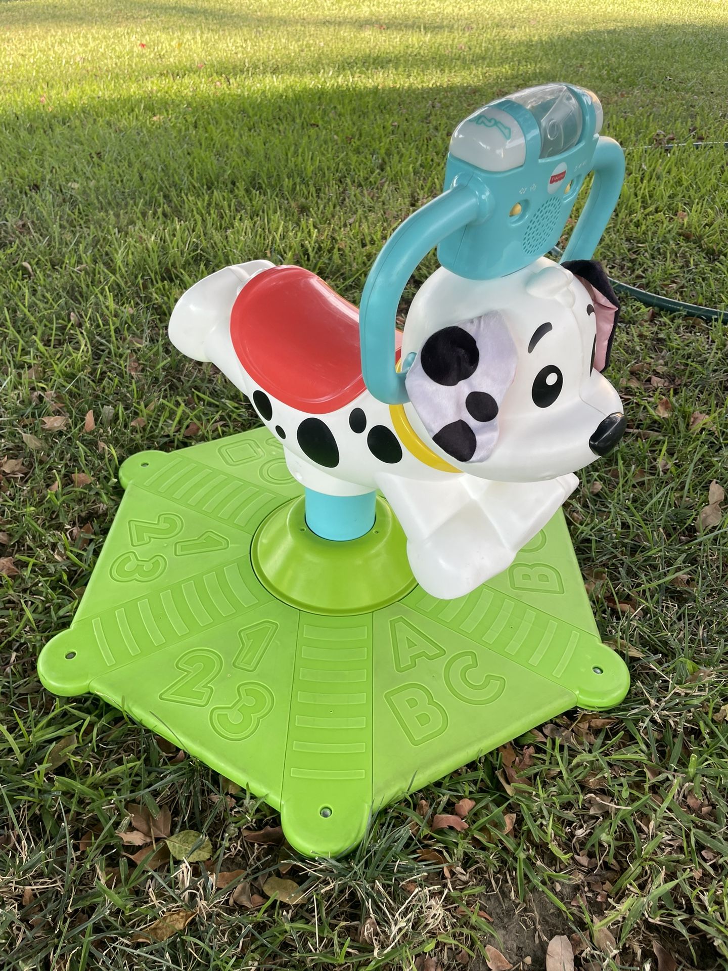 Fisher-Price Bounce and Spin Puppy Musical Ride-On Learning Toy for Babies and Toddlers