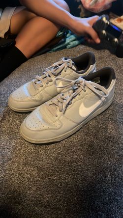 grey and white Nikes size 8.5