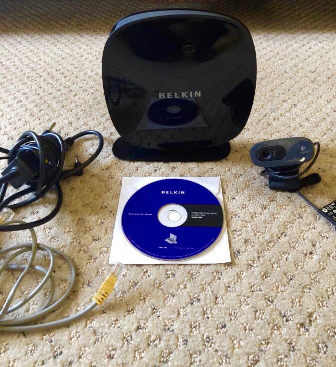 Used Belkin Wireless Dual Band 600 DB Router. Camera Logitech is free with purchase. For detailed information please go on {url removed}. Excellent