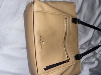 Purse I think it’s gray looks gray inside and out or brown