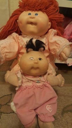 Dolls, Blankets, bibs, and bear with sleeping bag