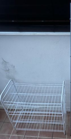 white metal shoe rack is a 4-tier organizer