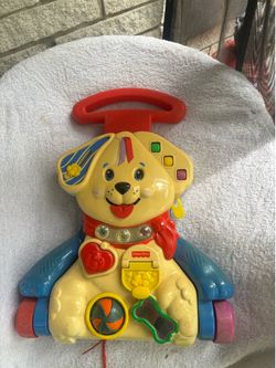 This toy is a vintage 1999 Fisher-Price "Bingo" Dog Activity Walker / Crib Toy.