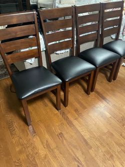 Nice 4 leather dining chairs in excellent condition