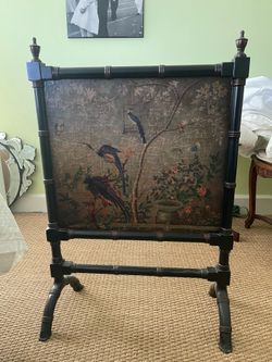 Antique fireplace screen bird theme