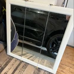 a tri-view mirrored cabinet