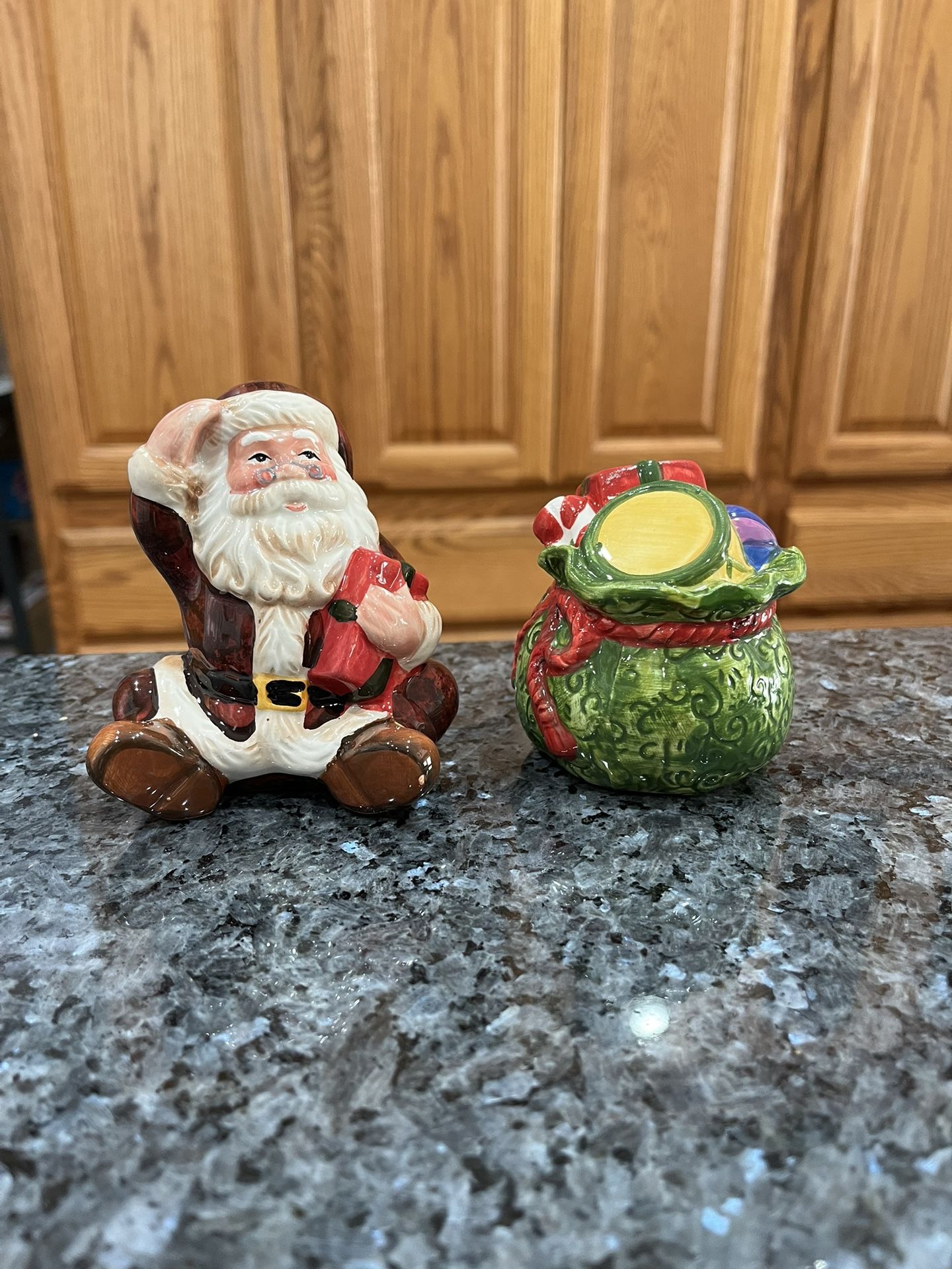 Vintage Ceramic Santa Claus and Toy Gift Sack Bag Pair of Salt and Pepper Shakers . Size approximately 4 inches tall Santa. Preowned never used. Ha