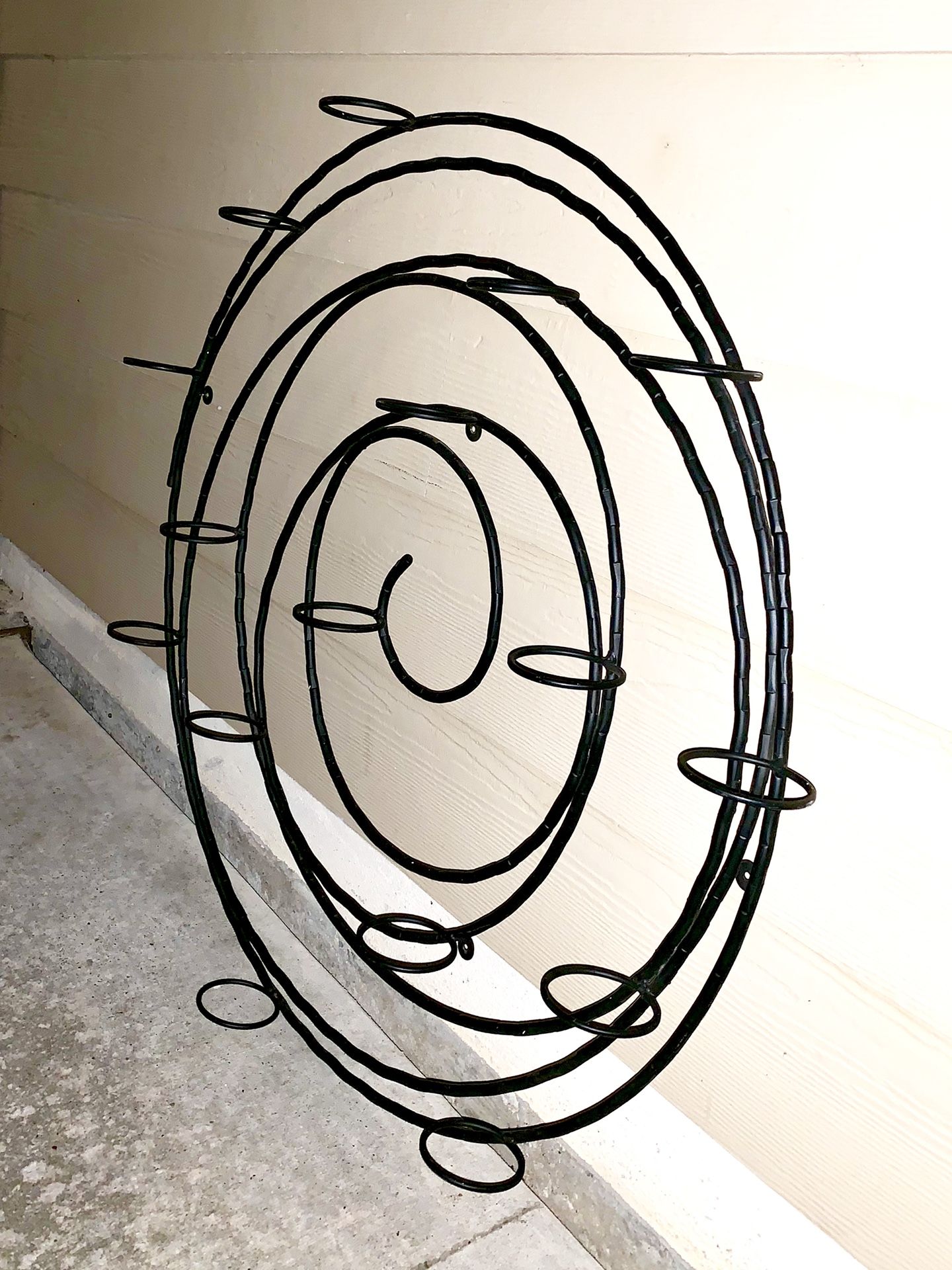 Spiral metal wall candle holder