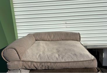 39”x44” FurHaven Pet Products sofa bed features a plush gray faux fur sleeping surface and supportive bolster walls