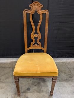 Ornate Carved Wood Accent Chair with Yellow Upholstered Seat