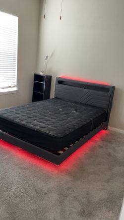Queen size floating bed with mattress included and underneath lights with charging outlets