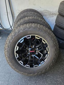 18" GM stocks factory rims w/ Goodyear AT tires