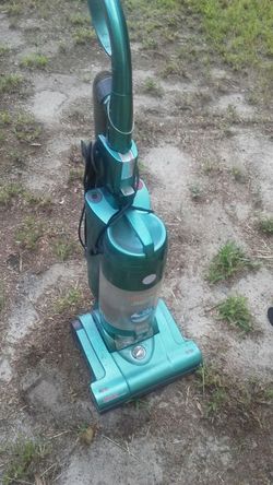 Teal colored. Brissell cyclone vaccum