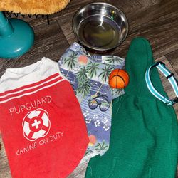 Preowned size L boy doggie clothes in good condition just a little faded. Blue pet collar and a steel water bowl located Off lake mead and Simmons are