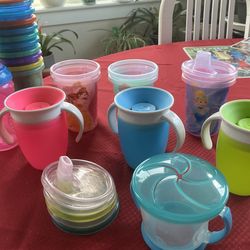Lots of sippy cups with lids