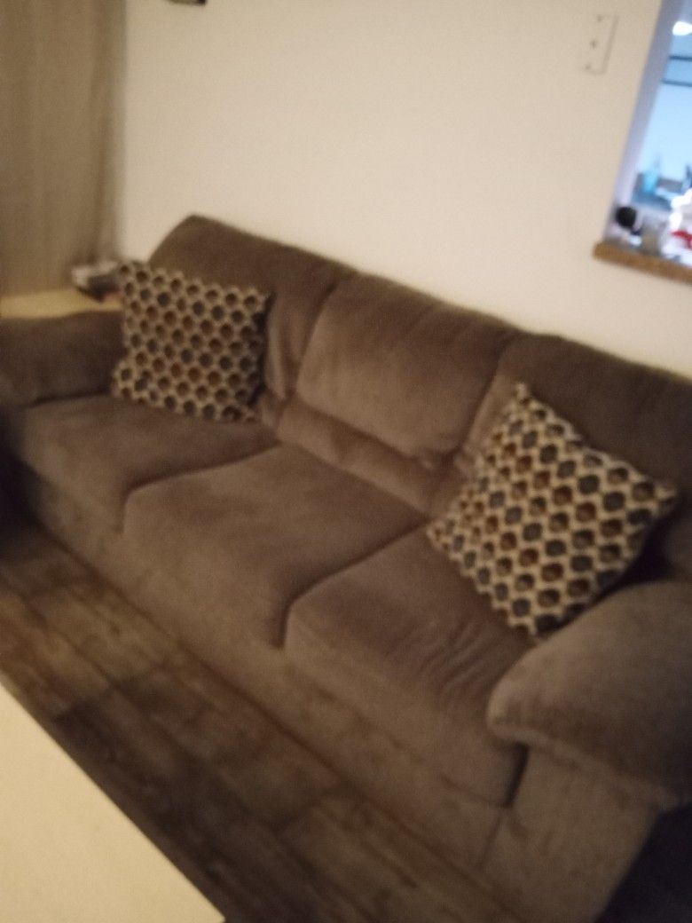 Clean Soft Brown Couch With Pillows