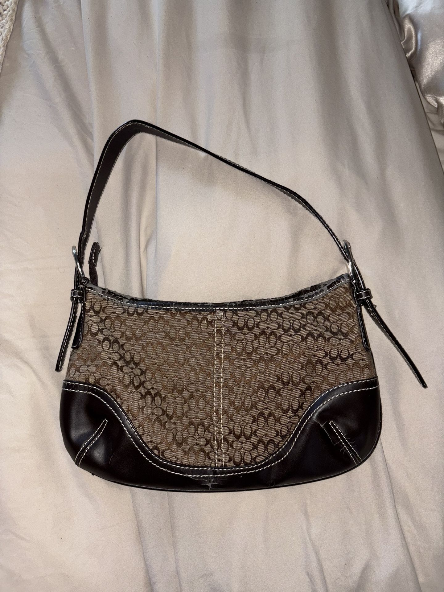 brown COACH bag and wallet