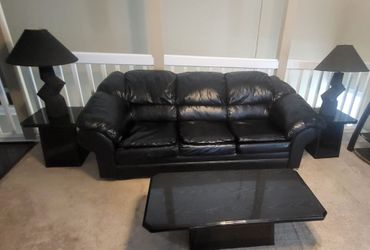 Sofa with tables and lamps