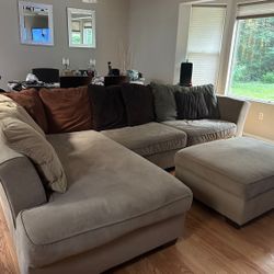 Elegant sectional couch with ottoman