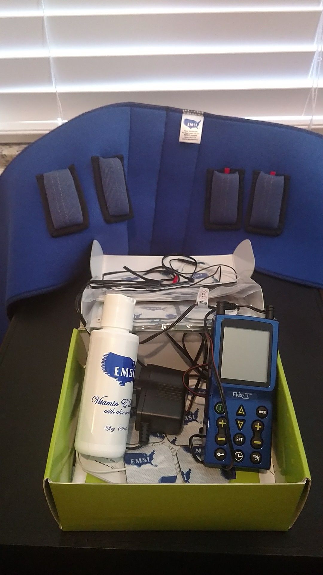 Tens Unit - EMSI Flex-IT with back brace attachment.