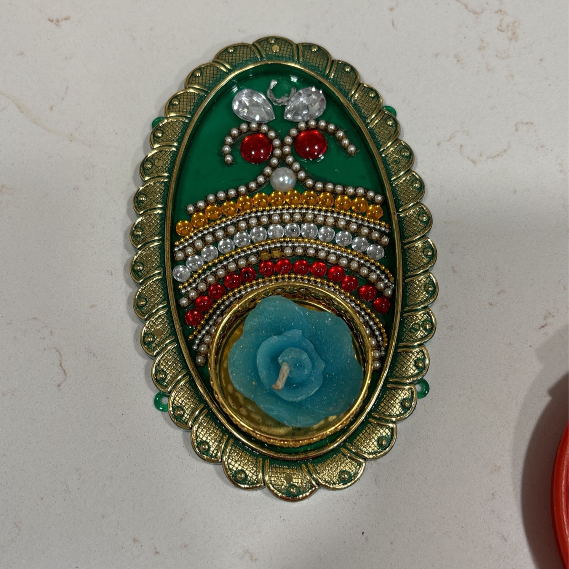 Decorated tea candle holder.