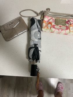 2 coach wristlets and umbrella