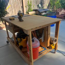 Custom workbench for a miter saw and table saw for sale $200. Does not include any power tools or equipment. Just a workbench for sale. 