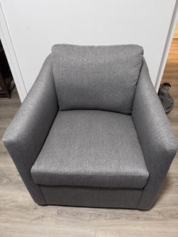 Grey Swivel Armchair $200