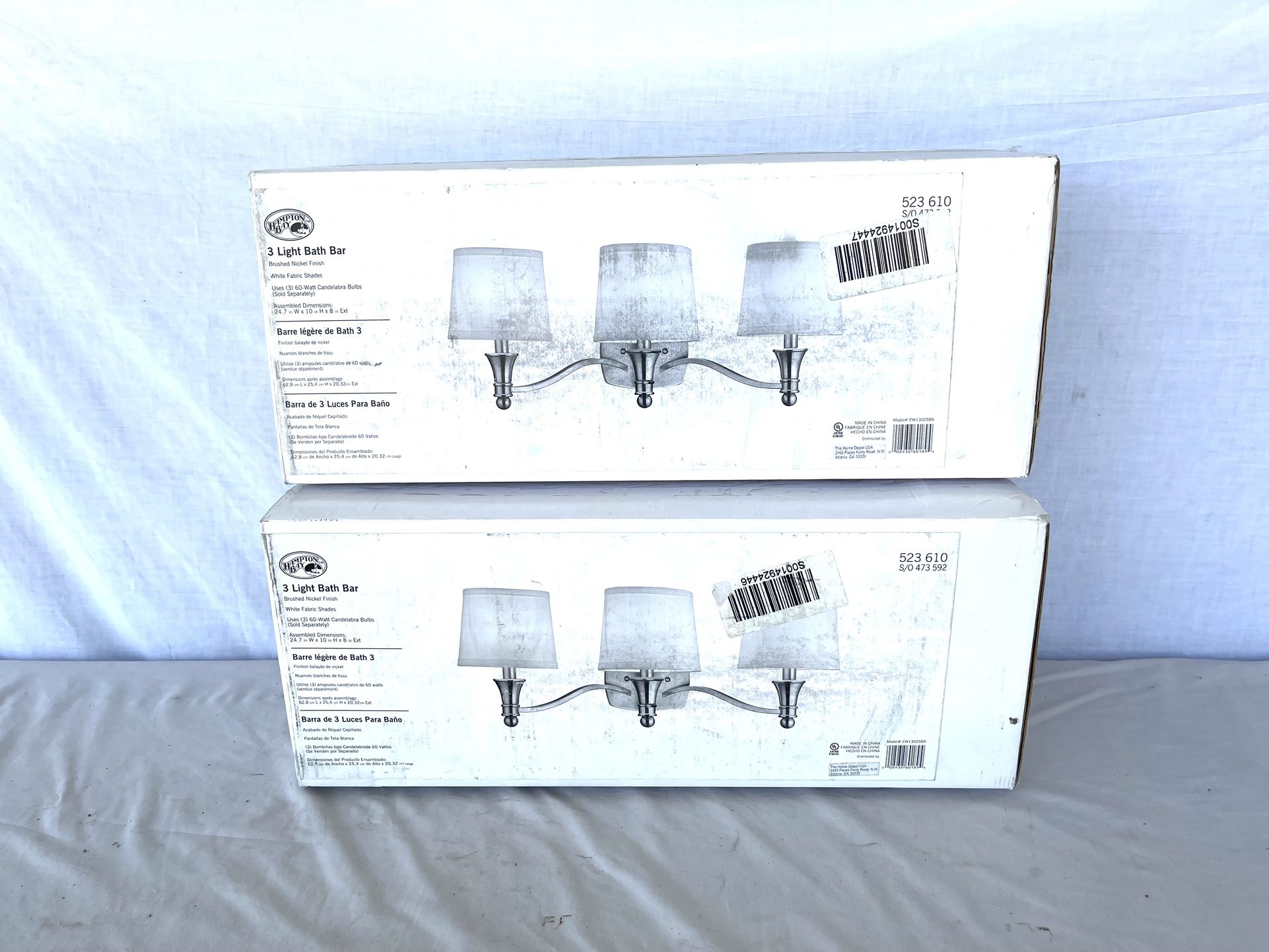 (2) Brand New In The Boxes (Hampton Bay) Three Light Basketball Light Fixtures. Brush Nickel Finish With White Cloth Shades, Retails For $99 Each. I’l
