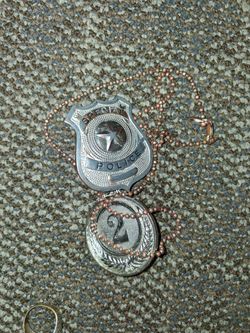 Police badge with a second place medal