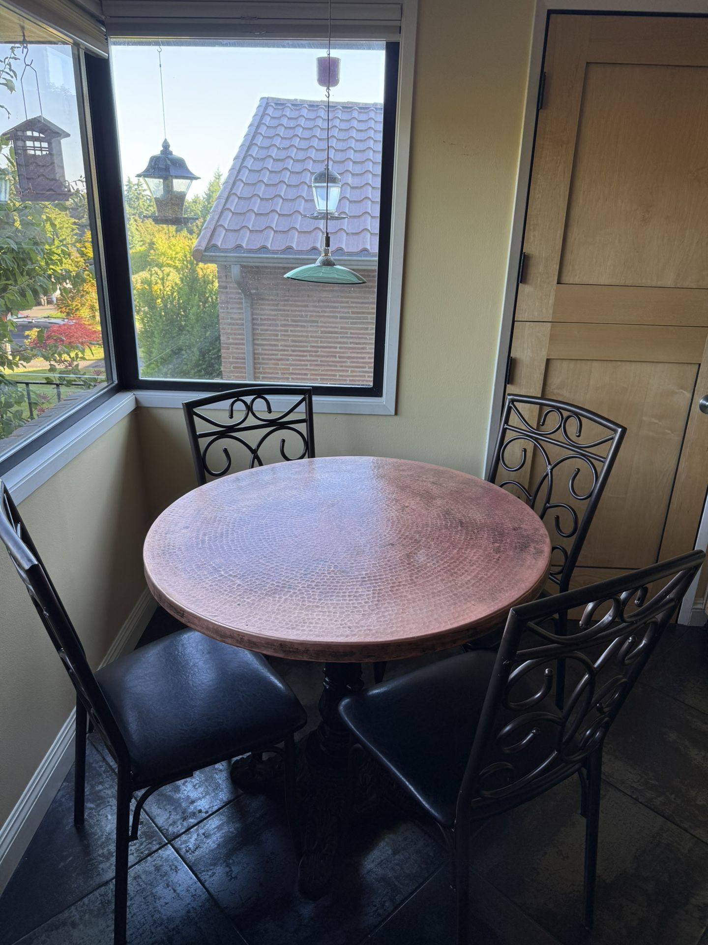 Hammered copper dining table and chairs