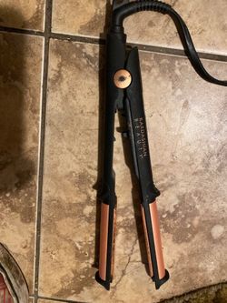 Lots of flat irons and hair curlers 70 for all