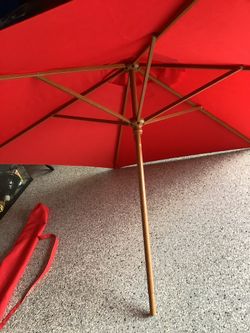 Coca Cola fabric with garden umbrella approximately 82” across never used.  Embroidered letters with carry bag, original tags beautiful bamboo like po