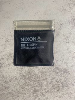This is a Nixon The Kingpin watch extra link pouch. No manual, one extra link.