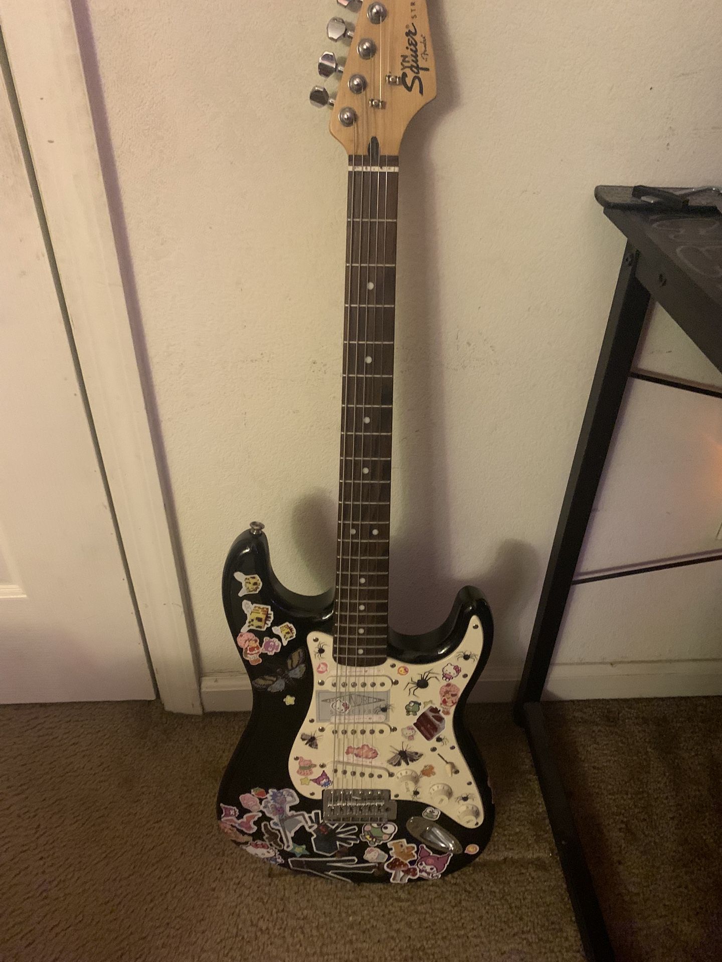 Black And White Squire Stratocaster Guitar