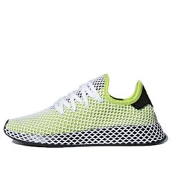 adidas Deerupt Runner in size 13 is a stylish and versatile low top sneaker designed for men. Featuring a classic combination of yellow, white, and bl