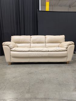 Cream Three-Seat Leather Couch with Pillow Arms