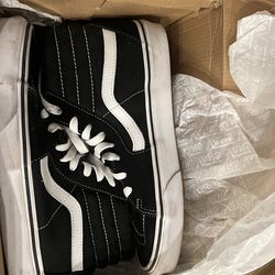 Black and white high top vans