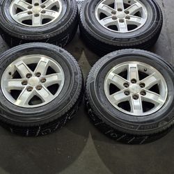 17" Original GMC YUKON WHEELS WITH 245 70 17 BRIDGESTONE TIRES.