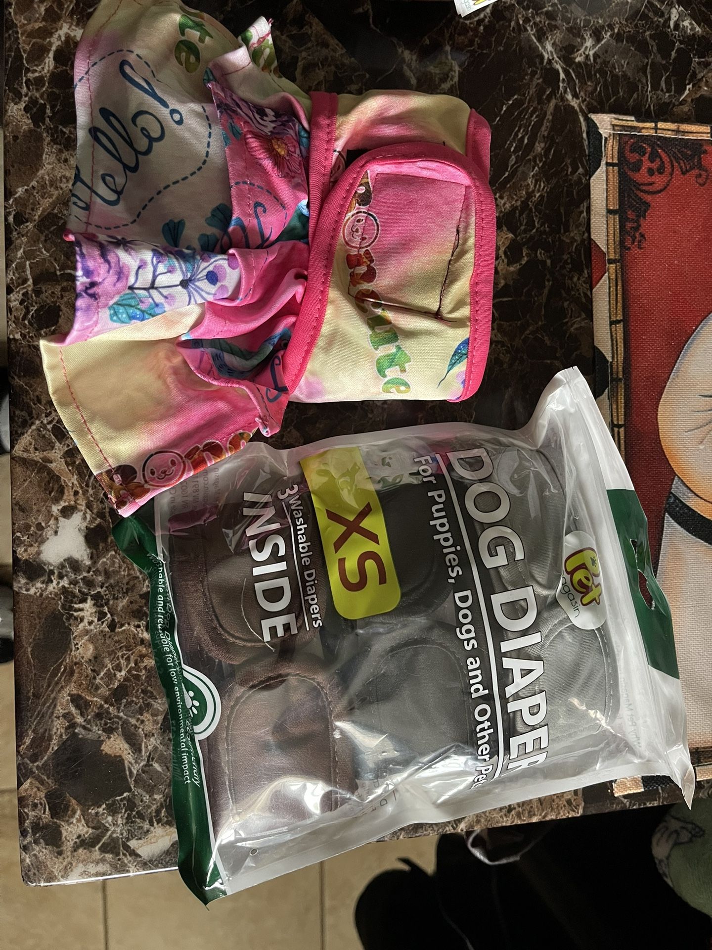Three Extra Small, Washable Dog Diapers, And One small with ruffles all for 20
