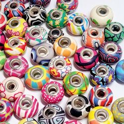 50pcs 11x16mm Clay Big Hole (5mm) Beads Assorted Colors & Design With Bracelet. The beads are made of clay.The core is made of silver plated copper. T